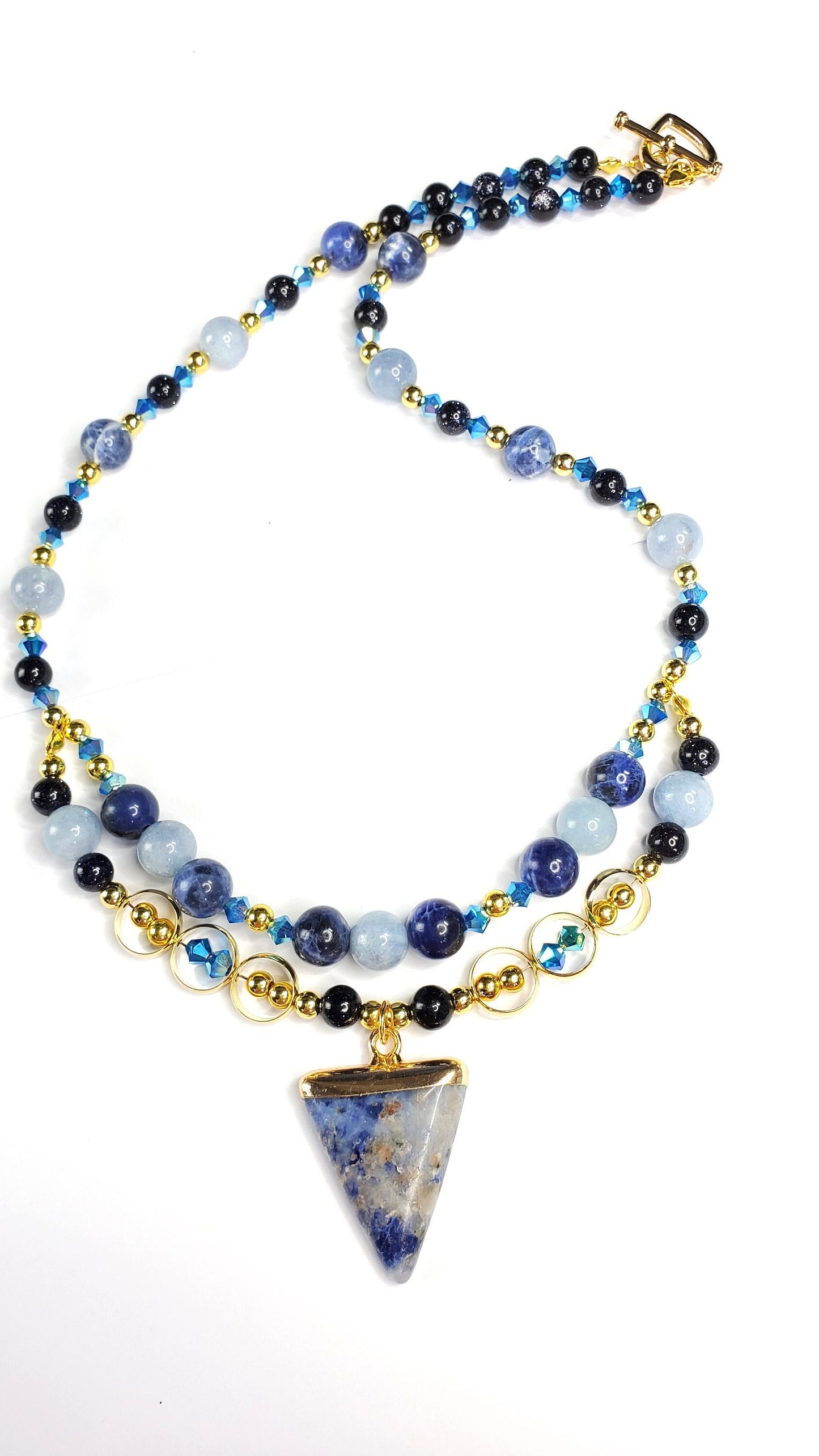 Sodalite and Agate Blue & Gold Gemstone Necklace with Agate, Sodalite, and Goldstone Beads along with a Sodalite and Brass Pendant